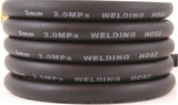 Coiled black welding gas hose markings