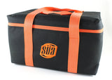 SÜA black carrying bag with orange handles