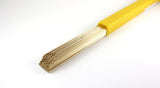 Bronze rods extending from a yellow tube, angled view