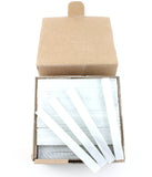 Open box containing flat white soapstone markers